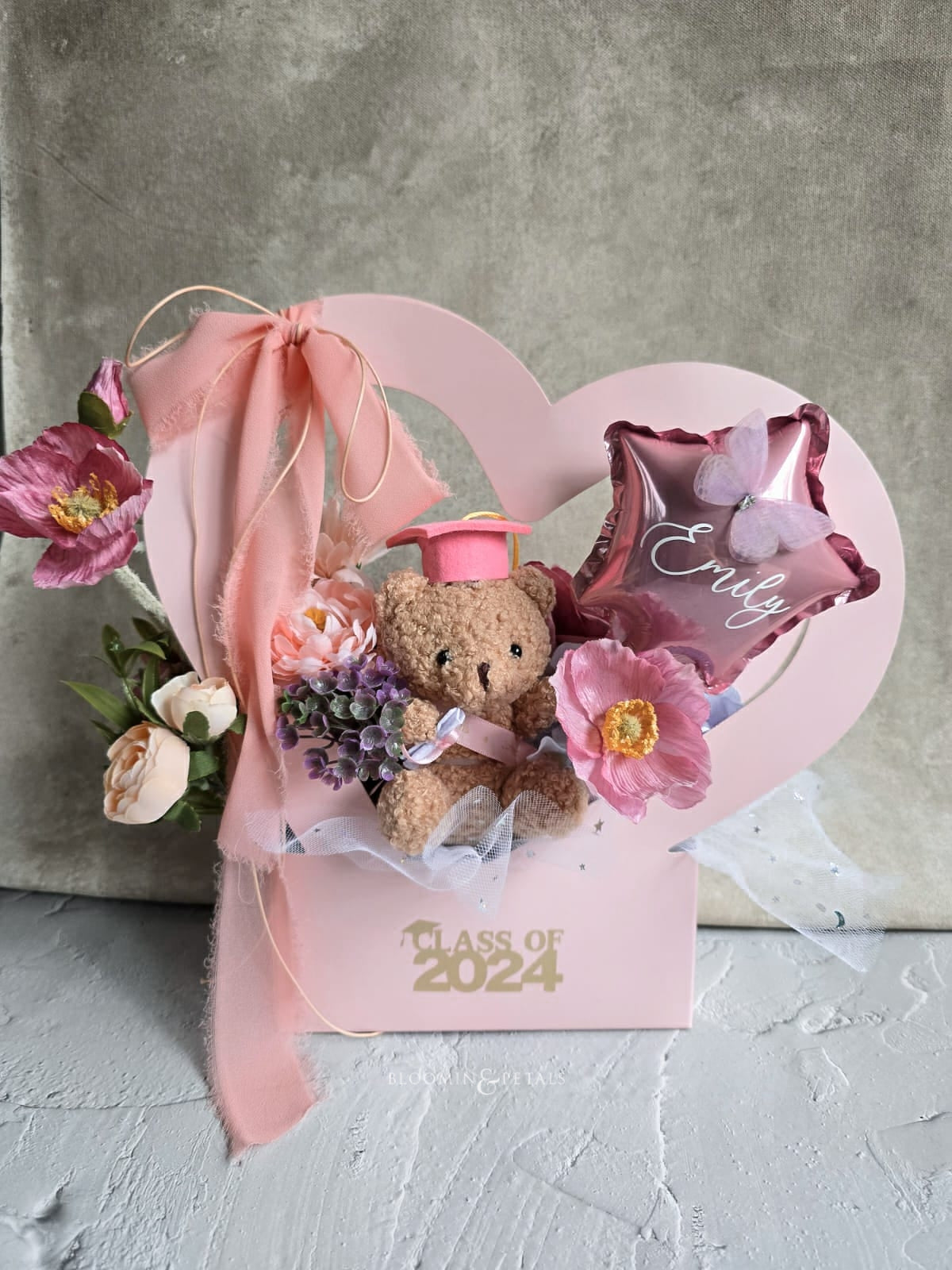 Heart shape box floral arrangement with cute graduation teddy bear and star foil balloon