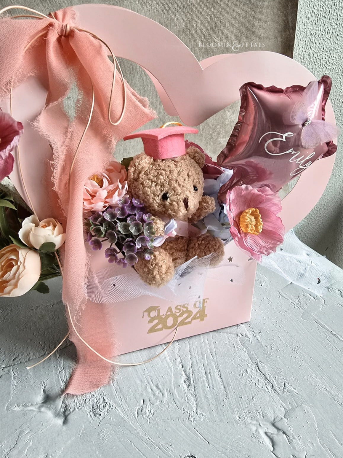 Heart shape box floral arrangement with cute graduation teddy bear and star foil balloon