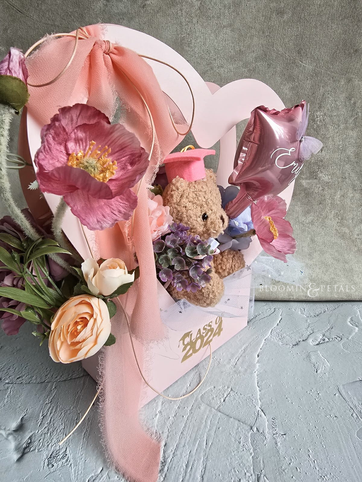 Heart shape box floral arrangement with cute graduation teddy bear and star foil balloon