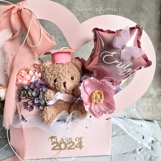 Heart shape box floral arrangement with cute graduation teddy bear and star foil balloon